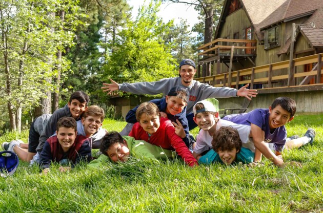 Boys posing on ground.