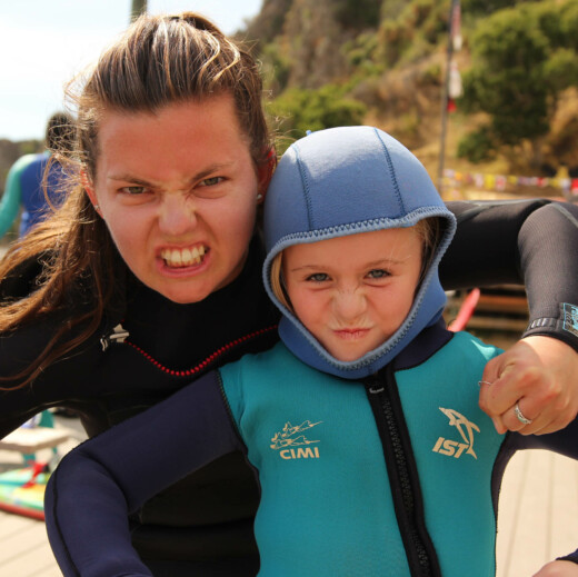 Snorkel instructor and young girl.